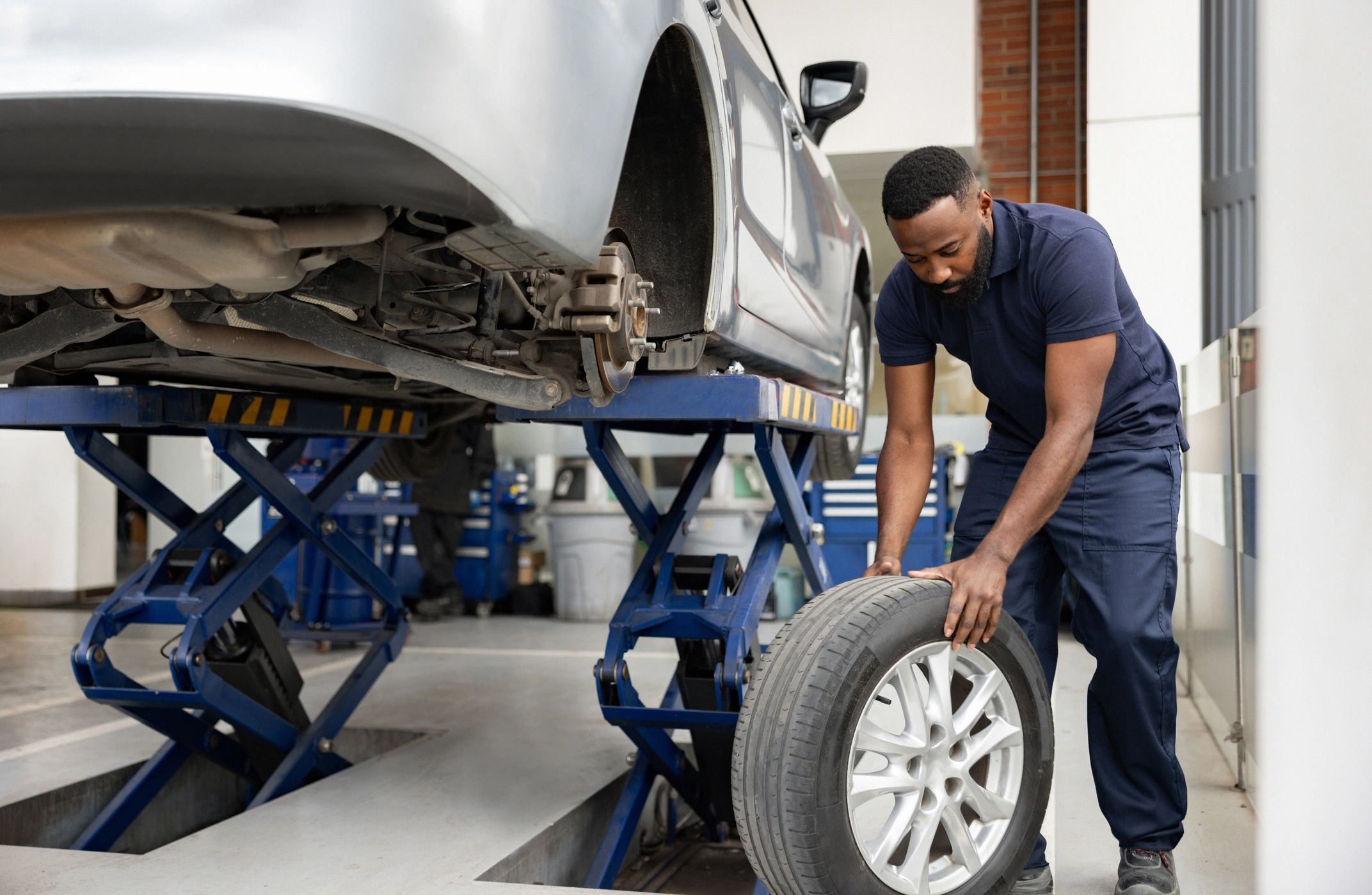mechanic changing tire